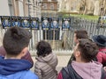 TouristÃ¢â¬â¢s looking at placards of government party members during the Brexit crisis. Royalty Free Stock Photo